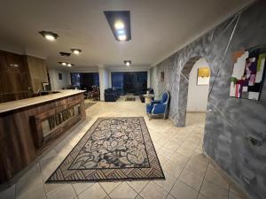 a living room with a tile floor and a lobby at Arabesque Hotel in Cairo