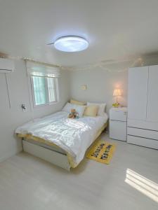 Postel nebo postele na pokoji v ubytování Rapym Coliving House