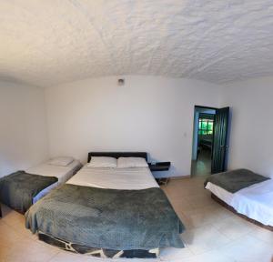 Postel nebo postele na pokoji v ubytování Casa campestre Finca la Roca