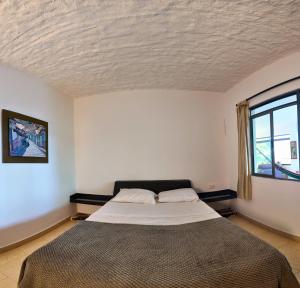 Postel nebo postele na pokoji v ubytování Casa campestre Finca la Roca