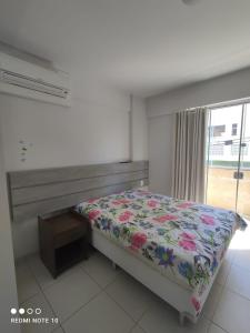 Ένα ή περισσότερα κρεβάτια σε δωμάτιο στο Apartamento Mont Blanc com piscinas quentes