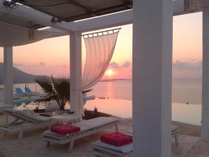 a view of the sunset from the patio of a resort at Kaladi Rock in Avlemonas