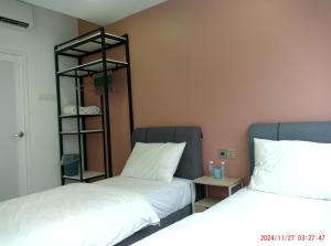 Postel nebo postele na pokoji v ubytování Gemilang Hotel Klang