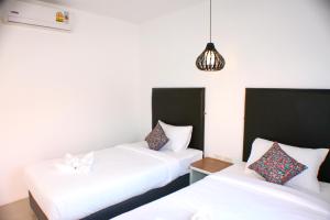 Postel nebo postele na pokoji v ubytování Non Du Lay Guesthouse