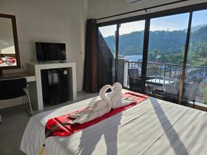 Ein Bett oder Betten in einem Zimmer der Unterkunft DB Studios Samui - Adults Only