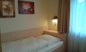 Postel nebo postele na pokoji v ubytování M&M Hotel - Seevetal