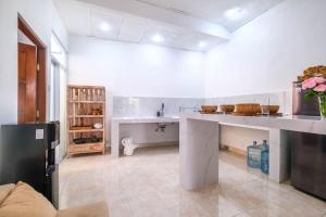 a large white kitchen with a large counter top at Private 3BR Villa Bali Work & Relax Retreat near Canggu, Bathtub in Dalung +48 photos