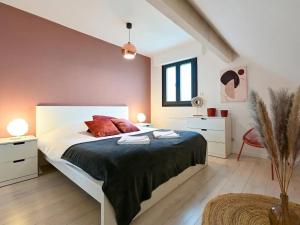 a bedroom with a large bed in a attic at Maison moderne avec jardin, confort et proximité Lille - FR-1-510-227 in Marcq-en-Baroeul