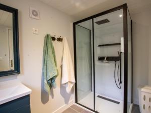 a shower in a bathroom with a glass shower stall at Chalet bois intime avec Wifi, piscine partagée, à 1 km de St Pompont - FR-1-616-429 in Saint-Pompont
