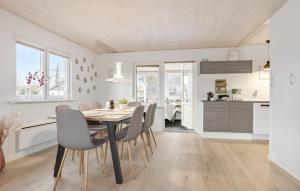 a kitchen and dining room with a table and chairs at Amazing Home In Haderslev With Wifi in Haderslev