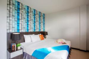 Postel nebo postele na pokoji v ubytování The Wings Boutique Hotels Krabi Ko Lanta