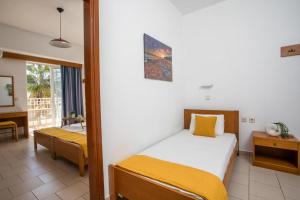 Postel nebo postele na pokoji v ubytování Lardos Sun View Apartments