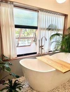 a bathroom with a large tub and a window at 영도 여는 in Busan +40 photos