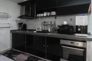 A cozinha ou kitchenette de Georgetown Karpal Singh Getaway 4BR 娱乐设施洋房乔治市
