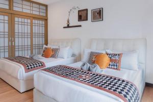 Uma cama ou camas num quarto em Georgetown Karpal Singh Getaway 4BR 娱乐设施洋房乔治市