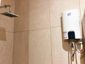 a soap dispenser on the wall of a bathroom at Gran Ubicación Terraza Privada Jacuzzi in Cozumel +13 photos