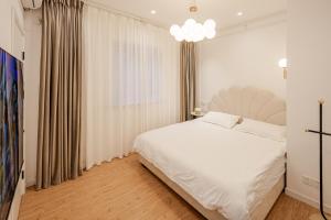 Tonight Aparthotel Jing'an Temple Shanghai客房内的一张或多张床位