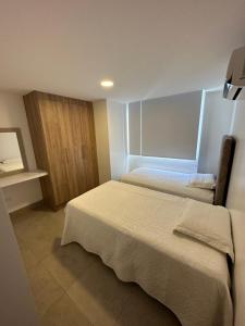Postel nebo postele na pokoji v ubytování APt CHINCHIPE