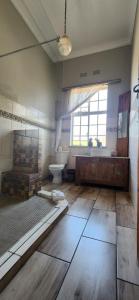 a large room with a bed and a large window at Bo Kamer Guesthouse in Ermelo +65 photos
