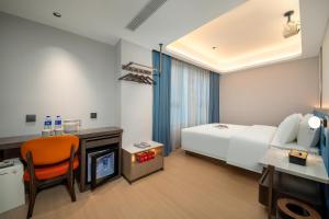 Postelja oz. postelje v sobi nastanitve Warm Yes Business Hotel -Free shuttle bus during the Canton Fair