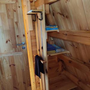 an inside view of a wooden cabin with a door at Tipi Cheyenne des monteaux in Vivy +50 photos
