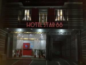 a hotel sign on the front of a building at Hotel Star 88 in Ngabean