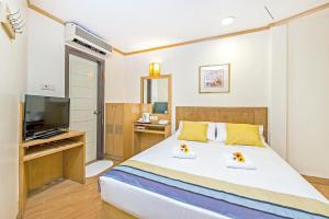 Postel nebo postele na pokoji v ubytování Hotel 81 Sakura