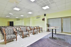 a room with a row of chairs and a podium at VITS Select Bharuch in Bharūch
