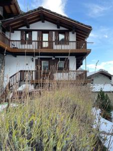 a house on top of a hill with snow at La Maison del Bon Grato in Champorcher +13 photos