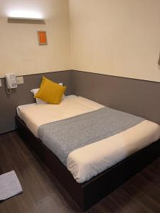 Postel nebo postele na pokoji v ubytování ホテルグランフォート