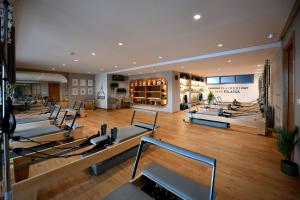 a gym with a lot of pilates equipment at Ocean Park Hotel, Premium Suites & Wellness in Casablanca