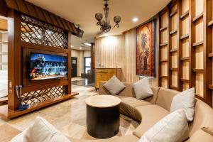 TV a/nebo společenská místnost v ubytování OHYA Chain Boutique Motel-Yongkang