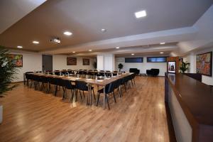 a large meeting room with a long table and chairs at Ocean Park Hotel, Premium Suites & Wellness in Casablanca +76 photos