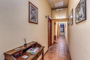 a corridor of a hallway with a hallway at Locanda San Cosimato in Rome