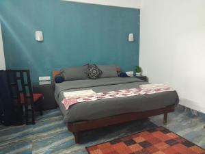 Postel nebo postele na pokoji v ubytování Janets & Johns Beach Resort since 1989