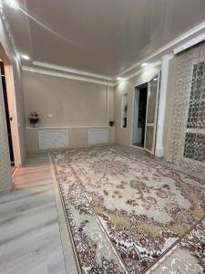 an empty room with a rug on the floor at 3х комнатная по Толе би in Taraz