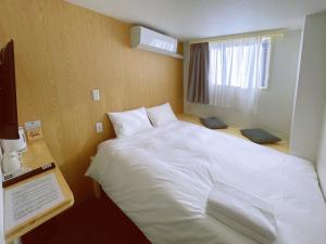 Postel nebo postele na pokoji v ubytování Softlight Inn Asakusa Tokyo