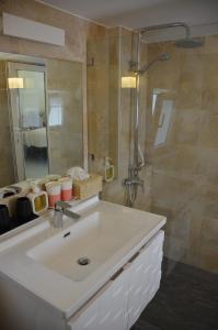a bathroom with a white sink and a shower at Villa Leo - Koh Chang in Trat +12 photos