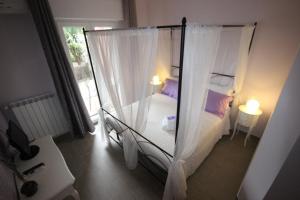 Postel nebo postele na pokoji v ubytování B&B Ai Tre Archi
