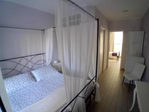 Postel nebo postele na pokoji v ubytování B&B Ai Tre Archi