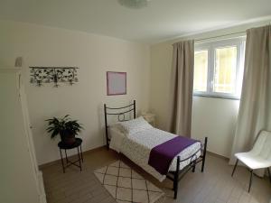 Postel nebo postele na pokoji v ubytování B&B Ai Tre Archi