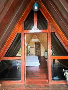 a room with a bed inside of a tent at 385 Glamping in Ban Khai Nao (1)