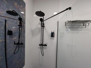 a room with three lights on a wall at CARMELO APARTAMENTo in San Jose de la Rinconada