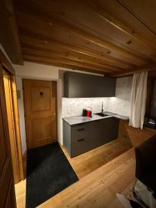 a kitchen with a sink and a counter top at Kitzbühel City Appartement in Kitzbühel