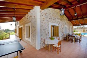 a living room with a ping pong table in a house at Finca Rafael in Búger