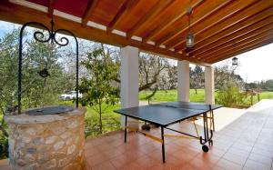 a ping pong table sitting on a patio at Finca Rafael in Búger