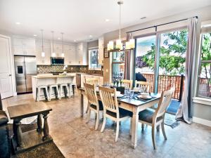 a kitchen and dining room with a table and chairs at Entrada at Moab 598 in Moab