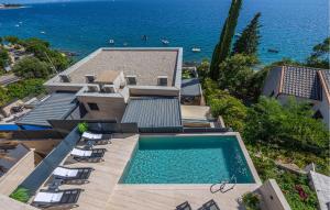 an aerial view of a house with a swimming pool at Awesome Apartment In Crikvenica in Crikvenica