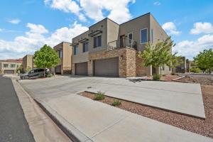 a house with a driveway in front of it at Entrada at Moab 420 and 424 in Moab