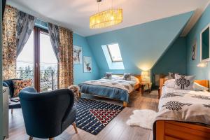 Posteľ alebo postele v izbe v ubytovaní Folkowy Dworek SPA & Fun